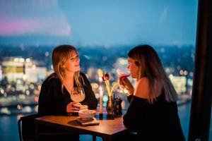 two girls sitting on a Romantic dinner in Amsterdam