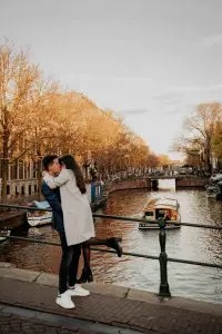 Engaged couple at classical bridge canals