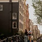 a group of people walking in front of a building