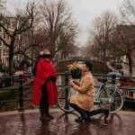 a man and a woman walking down a sidewalk