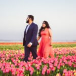 couple walking tulip fields amsterdam